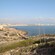 A placid seascape against a developed landscape